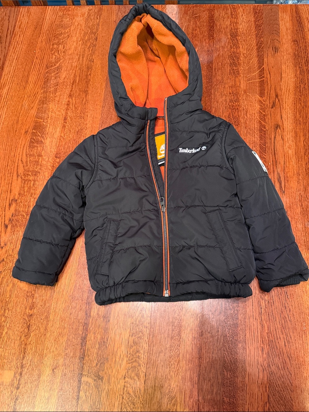 Timberland Kids Black Hooded Puffer Jacket with Orange Lining